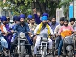 Nihangs and protesters riding motorcycles march during a 'Punjab Bandh' called following the killing of anti-drug activist Parvinder Singh Jhota in Jalandhar.