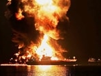A tanker on fire in the Strait of Hormuz