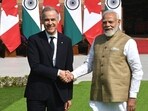 Prime Minister Narendra Modi shakes hands with his Canadian counterpart, Mark Carney, at Hyderabad House in New Delhi.
