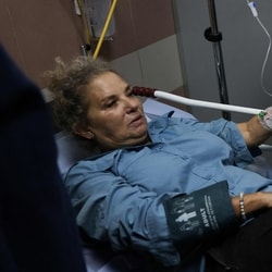 American freelance photojournalist Heidi Levine lies on a gurney in the emergency room of the government hospital in the Israeli-occupied city of Ramallah, as she is treated after being attacked by Israeli settlers while photographing Palestinian farmers harvesting their olives, in the Palestinian village of Abu Falah on October 16.