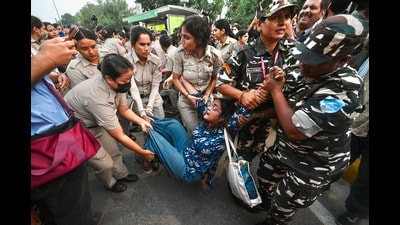 A protester being detained detained in central Delhi during CJP’s ‘Lehra Do Tiranga’ march on Friday. (Sanchit Khanna/Hindustan Times)