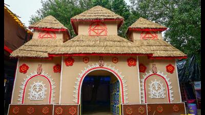 At Noida Kalibari in Sector 26, the pandal recreates a traditional kure ghor, or mud hut, inspired by rural houses of West Bengal. (Sunil Ghosh/HT ) At Noida Kalibari in Sector 26, the pandal recreates a traditional kure ghor, or mud hut, inspired by rural houses of West Bengal. (Sunil Ghosh/HT )
