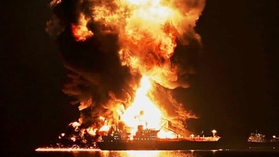 A tanker on fire in the Strait of Hormuz