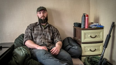 Stupnikov at his temporary apartment in Ukraine, where two sacks contain all his possessions and an anti-drone gun rests against the wall (Wall Street Journal) Stupnikov at his temporary apartment in Ukraine, where two sacks contain all his possessions and an anti-drone gun rests against the wall (Wall Street Journal)
