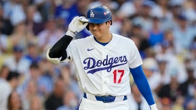 Shohei Ohtani’s knee and biceps injuries spark fan backlash against Dodgers manager Dave Roberts for keeping the struggling star in the lineup. (AP Photo/Ashley Landis) (AP Photo/Ashley Landis) Shohei Ohtani’s knee and biceps injuries spark fan backlash against Dodgers manager Dave Roberts for keeping the struggling star in the lineup. (AP Photo/Ashley Landis) (AP Photo/Ashley Landis)