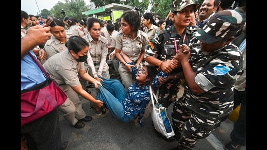 A protester being detained detained in central Delhi during CJP’s ‘Lehra Do Tiranga’ march on Friday. (Sanchit Khanna/Hindustan Times)