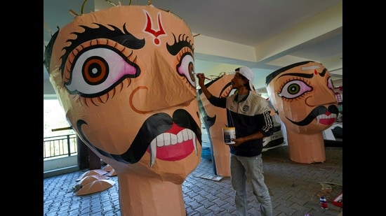 An artist prepares effigies ahead of the Dussehra festival at the Sankat Mochan Temple in Shimla on Friday. (Deepak Sansta/HT)