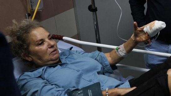 American freelance photojournalist Heidi Levine lies on a gurney in the emergency room of the government hospital in the Israeli-occupied city of Ramallah, as she is treated after being attacked by Israeli settlers while photographing Palestinian farmers harvesting their olives, in the Palestinian village of Abu Falah on October 16.