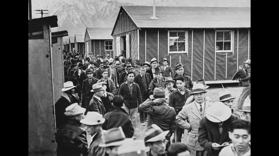 Japanese American detainees at Manzanar War Relocation Center in Owens Valley, Inyo County, California on 23rd March 1942. About 80,000 American citizens of Japanese descent were incarcerated in 10 American internment camps during World War II. (Getty Images)