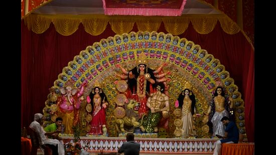 Lucknow came alive with the rhythmic beats of dhaks and the resonant sound of conch shells on Friday as devotees immersed themselves in the festive spirit of Durga Puja on Shashthi, marking the beginning of the city’s vibrant celebrations. (Deepak Gupta/HT)