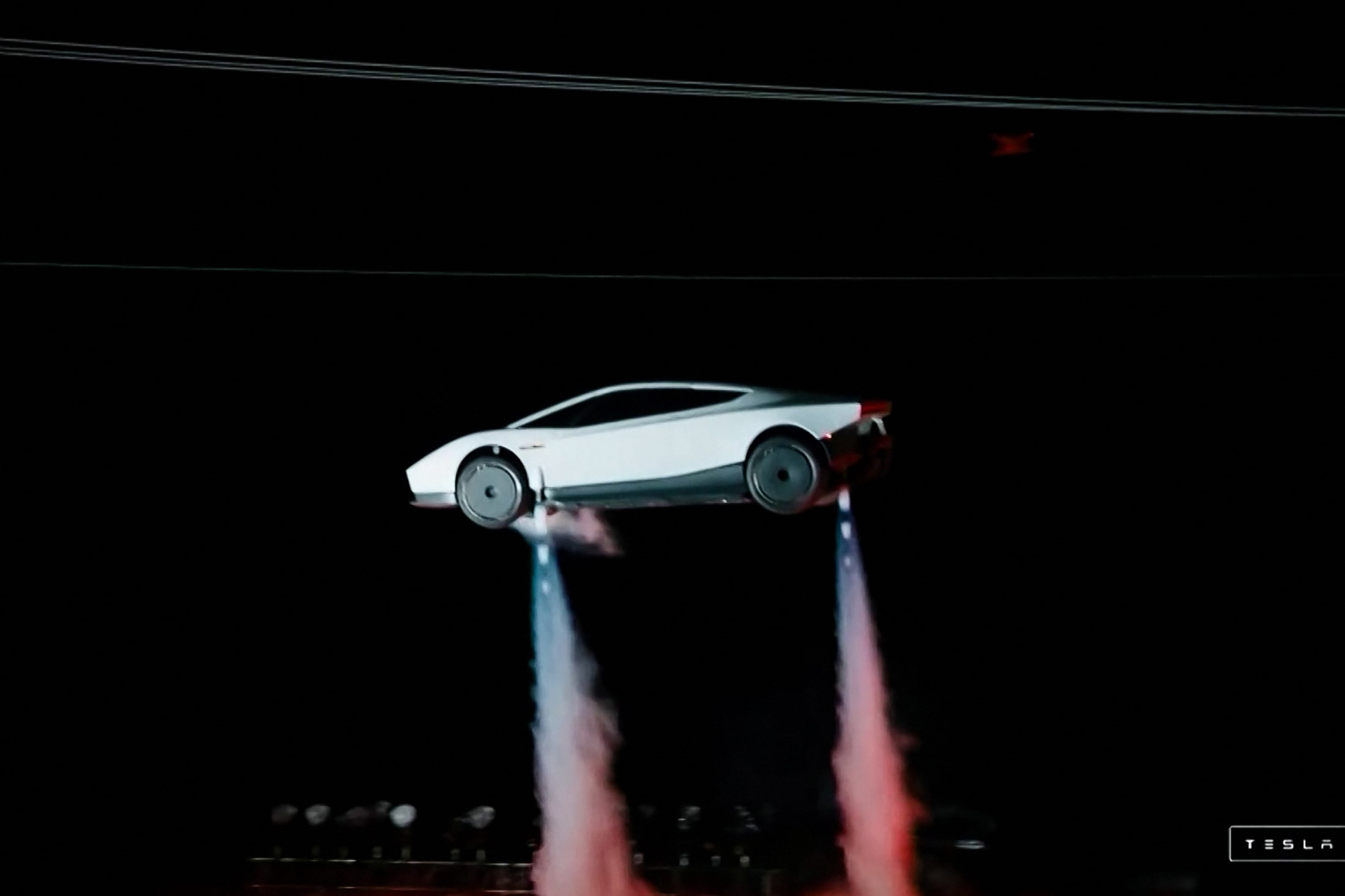 A grab taken from a live feed released by Tesla shows the company unveiling its next-generation Roadster electric car in McGregor, Texas. (AFP) A grab taken from a live feed released by Tesla shows the company unveiling its next-generation Roadster electric car in McGregor, Texas. (AFP)