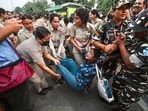 A protester being detained detained in central Delhi during CJP’s ‘Lehra Do Tiranga’ march on Friday. (Sanchit Khanna/Hindustan Times)