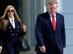 President Donald Trump walks out along with White House press secretary Katie Zacharia to talk to reporters before boarding Marine One on the South Lawn of the White House earlier this week. 