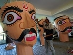 An artist prepares effigies ahead of the Dussehra festival at the Sankat Mochan Temple in Shimla on Friday. (Deepak Sansta/HT)