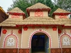 At Noida Kalibari in Sector 26, the pandal recreates a traditional kure ghor, or mud hut, inspired by rural houses of West Bengal. (Sunil Ghosh/HT )