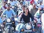 Congress’ Uttarakhand-in-charge Kumari Selja (sitting pillion on a bike at the front) leads a protest march in Dehradun on Friday against Dushyant Kumar Gautam’s appointment as Sikkim governor. (HT PHOTO)