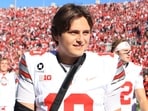 Julian Sayin walks off the field with his arm in a sling after defeating the Indiana Hoosiers.