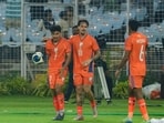 India's Anirudh Thapa, left, celebrates with Ryan Williams. 