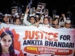 Members and supporters of Congress Seva Dal hold a candle march demanding justice in the Ankita Bhandari murder case.