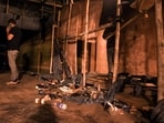 Footwear lies scattered outside a Durga Puja pandal after the exit gate collapsed due to heavy crowd pressure, leading to a stampede-like situation, in Kolkata, Saturday, Oct. 17, 2026. 