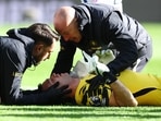 Chelsea's Emiliano Martinez receives medical attention after sustaining an injury. 