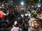 Students from the All India Students’ Association (AISA) and other student organisations detained by Delhi Police during the protest Tiranga march at Connaught Place on Friday. (Sanjeev Verma/Hindustan Times)