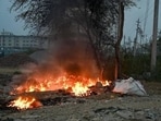 The police team reached the spot and found flames rising from the burning material, accompanied by thick smoke. The fire brigade was informed, and fire was brought under control. (HT File)