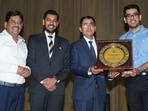 Varun Bhardwaj (second from the right) being felicitated by the school administration. (HT Photo)