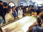 Tamil Nadu Chief Minister C. Joseph Vijay pays his respects by offering a floral garland on the mortal remains of the late music composer Deva at T. Nagar, in Chennai on Saturday. (@CMOTamilnadu X/ANI Photo)