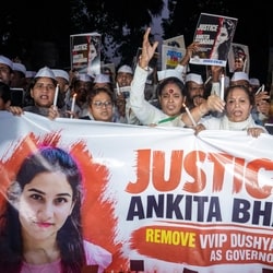 Members and supporters of Congress Seva Dal hold a candle march demanding justice in the Ankita Bhandari murder case.
