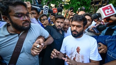 Cockroach Janta Party founder Abhijeet Dipke is detained by Delhi Police after stepping out of the residence where he was staying in Jhandewalan. (HT)