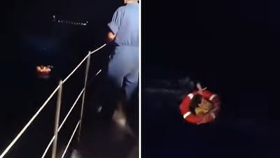 A woman being rescued in Greece. (YouTube/@HellenicCoastguard)