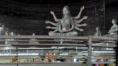 Footwear lies scattered outside a Durga Puja pandal after the exit gate collapsed due to heavy crowd pressure, leading to a stampede-like situation, in Kolkata on Saturday. (PTI)