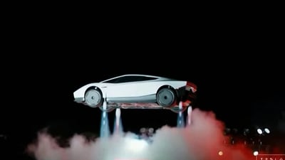 A grab from a live feed released by Tesla shows the company unveiling its next-generation Roadster electric car.