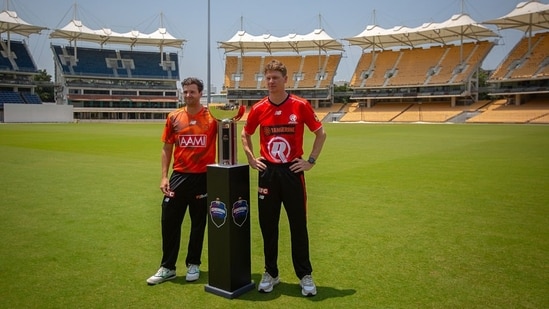 Jhye Richardson and Brendan Doggett with the BBL trophy in Chennai.