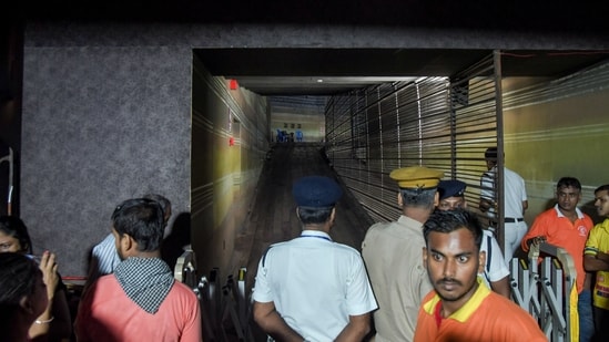 Kolkata: Security and police personnel control the area outside a Durga Puja pandal after the exit gate collapsed due to heavy crowd pressure, leading to a stampede-like situation, in Kolkata. Kolkata: Security and police personnel control the area outside a Durga Puja pandal after the exit gate collapsed due to heavy crowd pressure, leading to a stampede-like situation, in Kolkata.