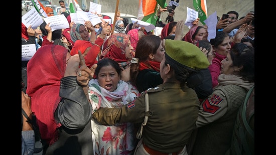 Police trying to stop the Congress workers during their protest in Srinagar on Saturday. (Waseem Andrabi/HT)