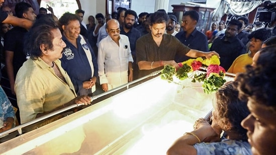 Tamil Nadu Chief Minister C. Joseph Vijay pays his respects by offering a floral garland on the mortal remains of the late music composer Deva at T. Nagar, in Chennai on Saturday. (@CMOTamilnadu X/ANI Photo)