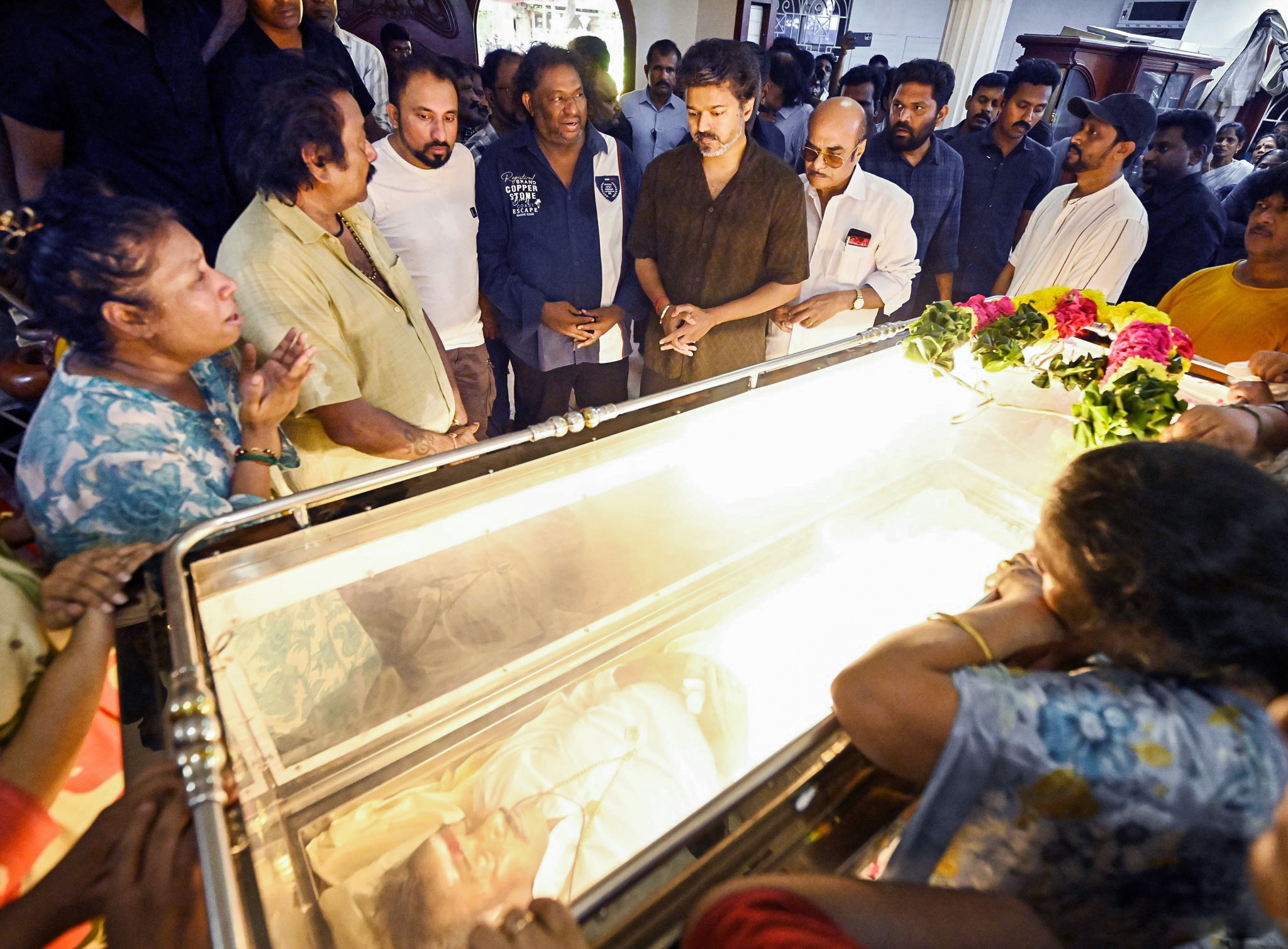 Chennai, Oct 17 (ANI): Tamil Nadu Chief Minister C. Joseph Vijay pays his respects by offering a floral garland on the mortal remains of the late music composer Deva at T. Nagar, in Chennai on Saturday. (@CMOTamilnadu X/ANI Photo) (@CMOTamilnadu X)