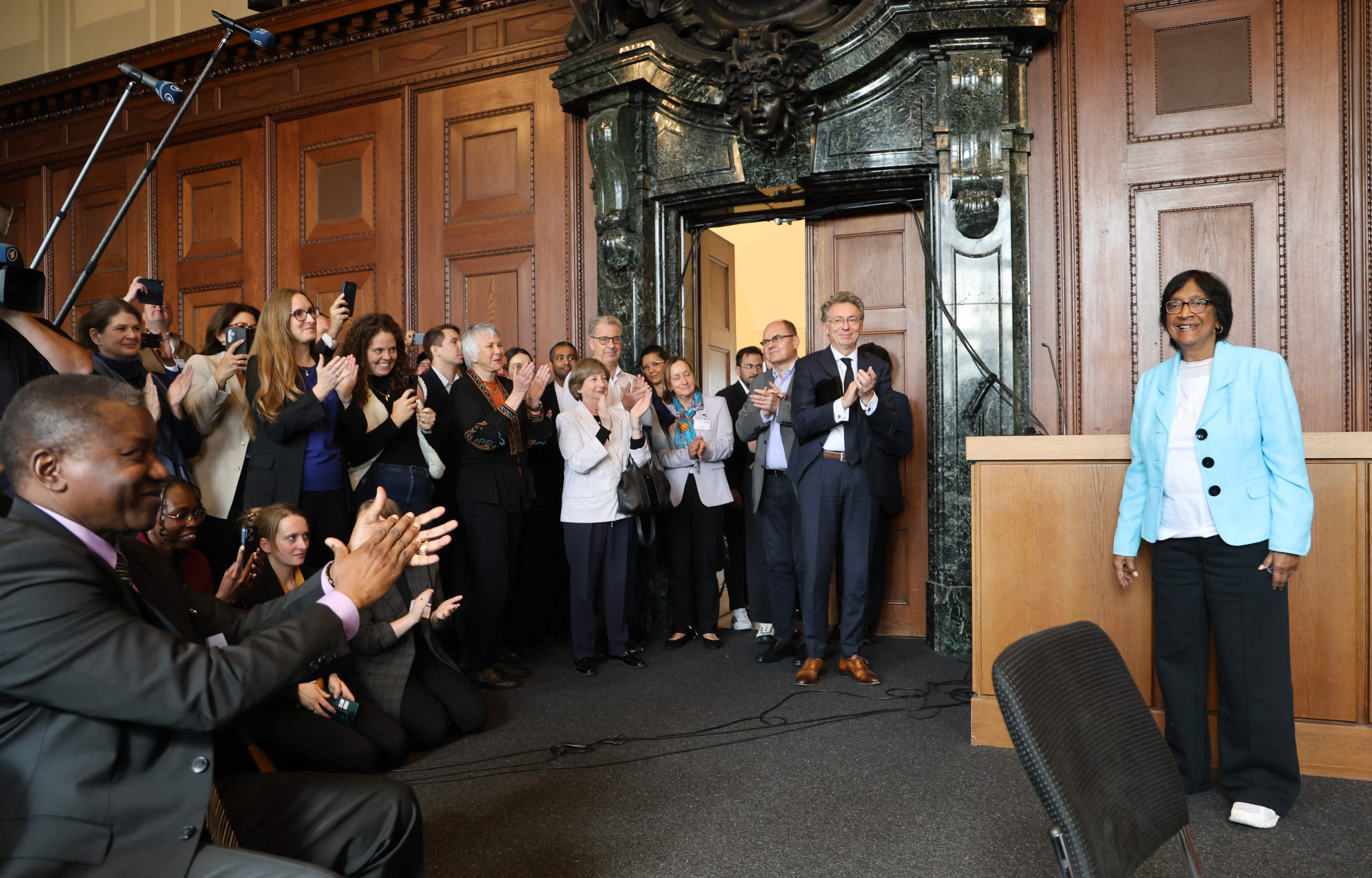 South African lawyer and champion of international law Navi Pillay (right) is pictured after it was announced that she'd won 2026 Nobel Peace Prize, at the historic Courtroom 600 of Nuremberg's Palace of Justice, venue of the 1945-1946 Nuremberg Trials against leaders of defeated Nazi Germany. (AFP Photo) South African lawyer and champion of international law Navi Pillay (right) is pictured after it was announced that she'd won 2026 Nobel Peace Prize, at the historic Courtroom 600 of Nuremberg's Palace of Justice, venue of the 1945-1946 Nuremberg Trials against leaders of defeated Nazi Germany. (AFP Photo)
