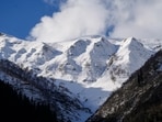 A view of snow-capped mountains following a fresh spell of snowfall near Zojila Pass along the Srinagar-Leh National Highway on Saturday. (PTI)