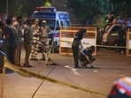 A forensic team collects samples from the spot where shots were fired at actor Tiger Shroff, in Mumbai on Sunday. Actor is safe and has not sustained any gunshot injuries. 
