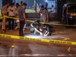 Forensic Experts and Police collect samples of evidence from the spot where unidentified assailants fired at Tiger Shroff. (Hindustan Times)
