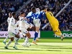 Chelsea goalkeeper Emiliano Martinez, right, picks up an injury during the English Premier League soccer match between Everton and Chelsea. 