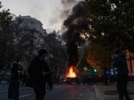 Violent clashes erupted across France as masked groups looted luxury stores, vandalised buildings and set vehicles on fire.
