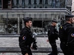French gendarmes patrol by the broken frontage windows of a shop a day after riot and looting following a nationwide protest against the "high cost of living", in Lyon, France.