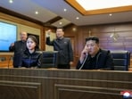 Kim Jong Un oversees the missile test on TV, accompanied by his daughter, Ju Ae, 