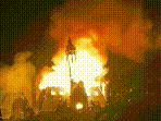 Witnesses said a group of masked protesters first set a police car on fire outside the town hall before smashing windows and entering the building to start a blaze.