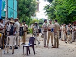 Gurugram: Police personnel outside Anjuman Mosque which was set ablaze in the Sector 57 area, in Gurugram district, Tuesday.
