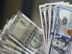 File image: Indian rupee (L) and US dollar currency notes 